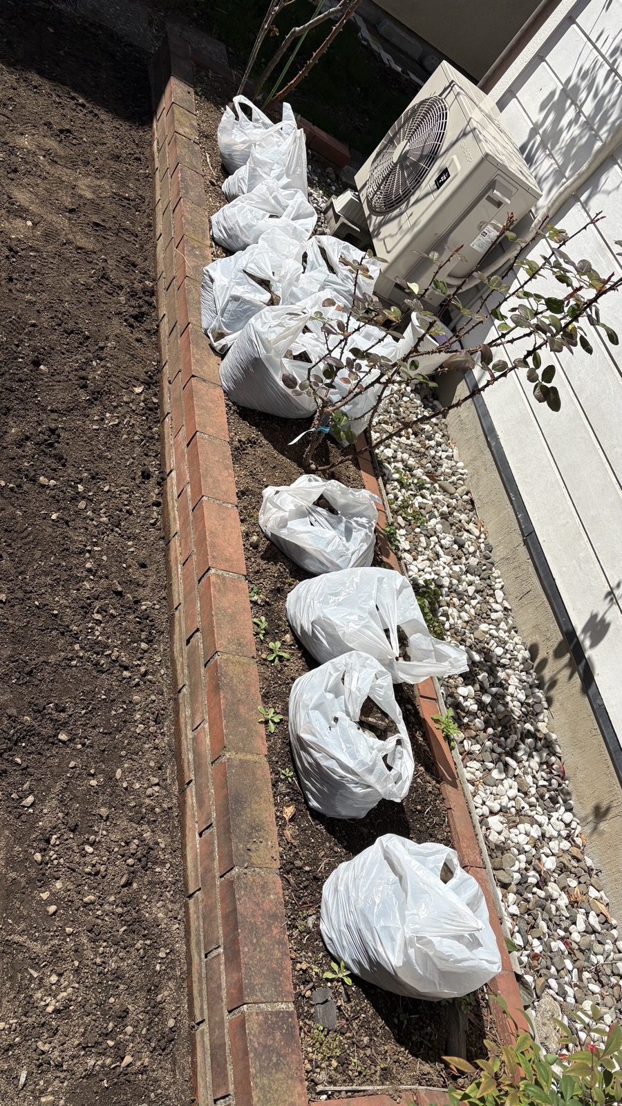 200kg of pebbles and soil in bags, waiting for removal