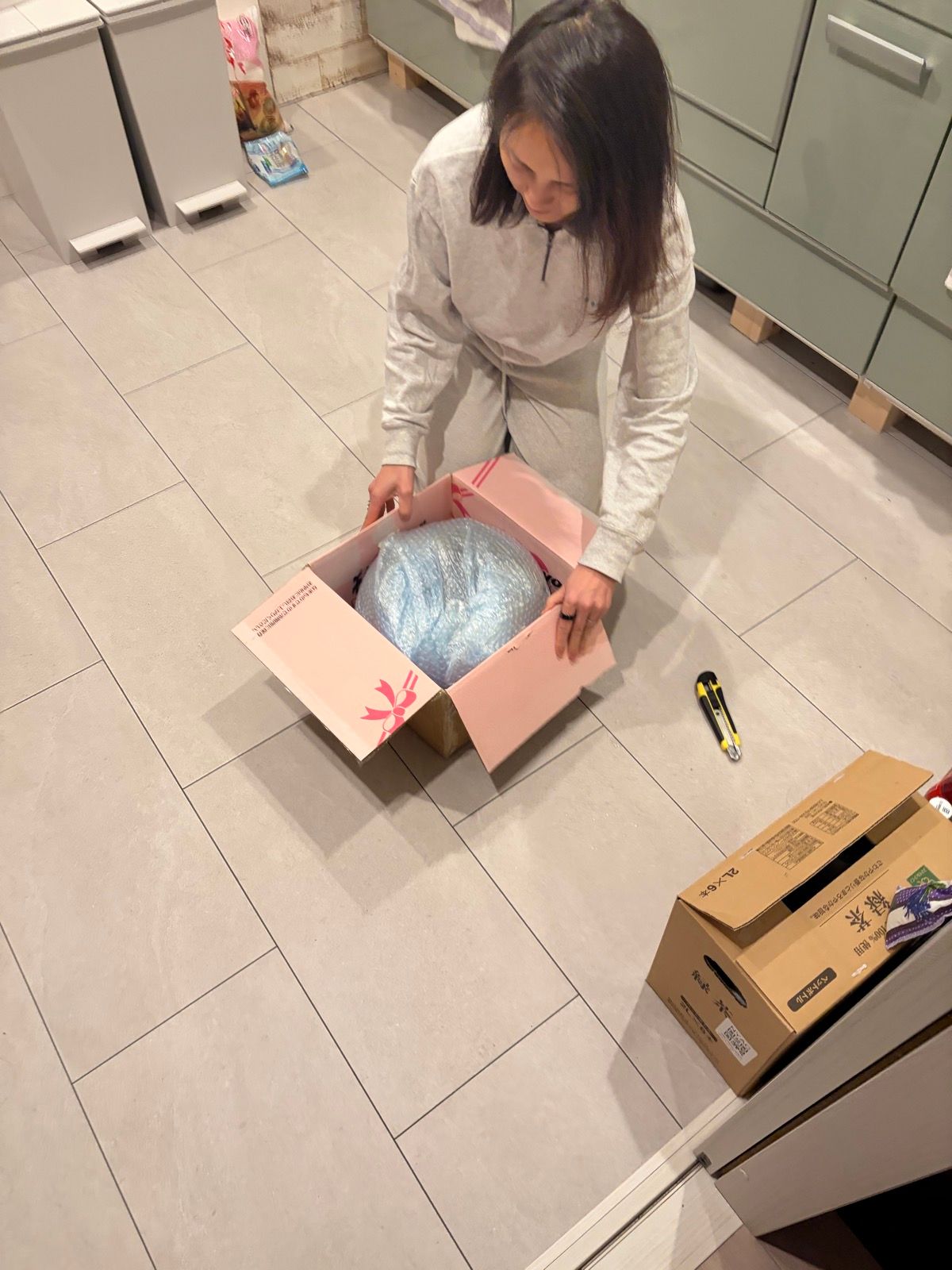 Inside the outer box — a pink gift box with the bubble-wrapped vase